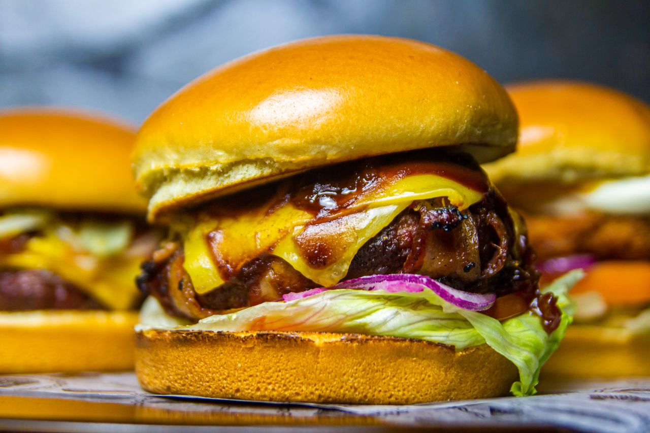 The Art of Drawing Readers In: Your attractive post title goes here Mouthwatering beef burger topped with cheddar and onions, ideal for food lovers.